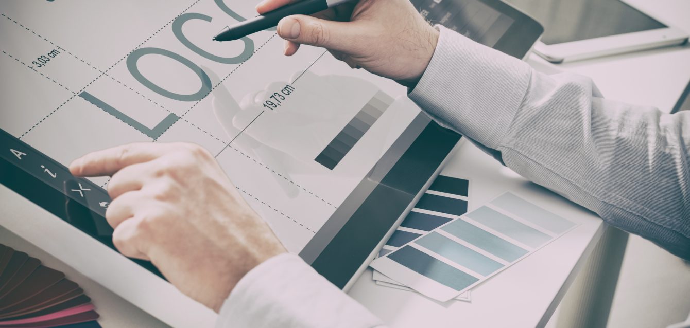 Graphic designer at work. Color samples.