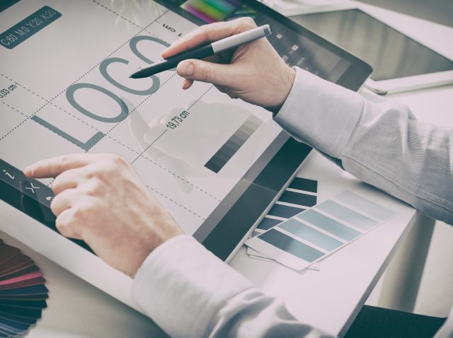 Graphic designer at work. Color samples.